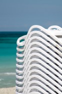 An image of beach chairs stacked up on the beach in Varadero, Cuba