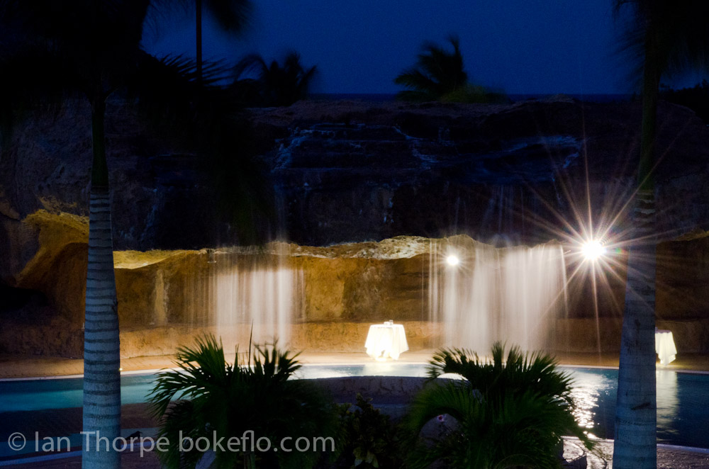An image of the waterfall at the Iberostar Laguna Azul pool, at night in Varadero Cuba