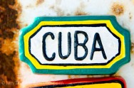 An image of a Cuba pin on a beach vendor's rusty cart