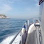 A private boat cruising along the coastline between Sorrento and the Amalfi Coast on it's way to Capri
