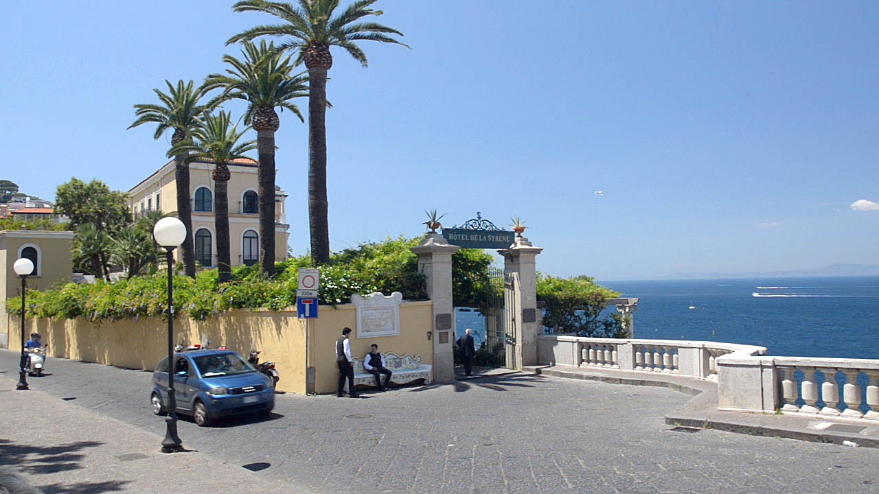 The entrance of the cliff top Hotel de la Syrene in Sorrento Italy with its palm trees and Mediterranean architecture