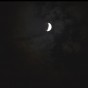 A time lapse frame of the Supermoon Lunar Eclipse of September 27 2015. at the parial ecllipse of the moon stage, with some clouds obscuring the view.