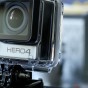 The photographis a close up of the GoPro Hero 4 Black Edition in a bit of an angle so the side and front are visible with the Hero 4 logo very prominent on the front of the GoPro