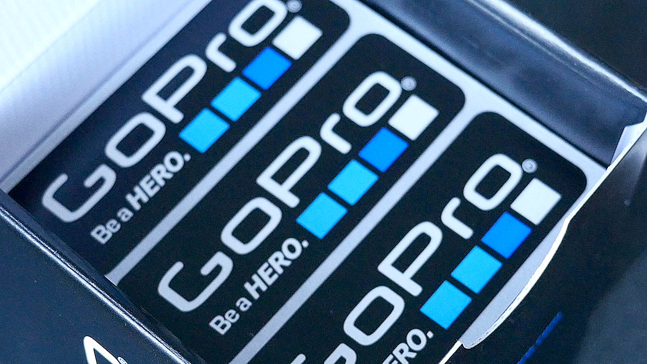The photograph is a close up of GoPro Stickers in the GoPro Hero 4 Black Edition box on a bit of an angle with the Be a HERO tagline very prominent on the front of the GoPro Stickers