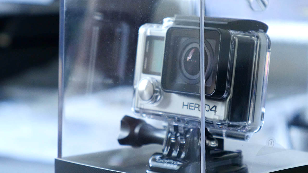 The photograph is a close up of the GoPro Hero 4 Black Edition iin it's box on a bit of an angle so the side and front are visible with the Hero 4 logo very prominent on the front of the GoPro
