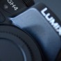 The Photograph shows the Panasonic Lumix GH4 camera body and the Panasonic Lumix and GH4 word marks